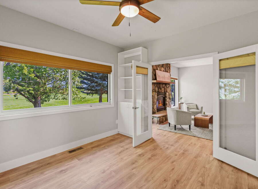 Step into this inviting space featuring a cozy living area with a stone fireplace and comfortable seating.