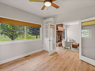 Step into this inviting space featuring a cozy living area with a stone fireplace and comfortable seating.