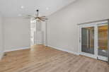 Experience spacious living in this modern home featuring a vaulted ceiling and a stylish ceiling fan.