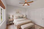 Experience serene comfort in this beautifully appointed bedroom, featuring a plush king-sized bed adorned with soft, neutral linens and accent pillows.