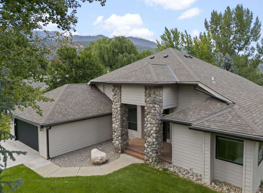 Discover this stunning home featuring a unique stone-accented entrance and a spacious garage.