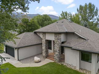 Discover this stunning home featuring a unique stone-accented entrance and a spacious garage.