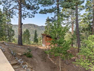 Discover a serene mountain retreat with breathtaking views of rolling hills and lush forests.
