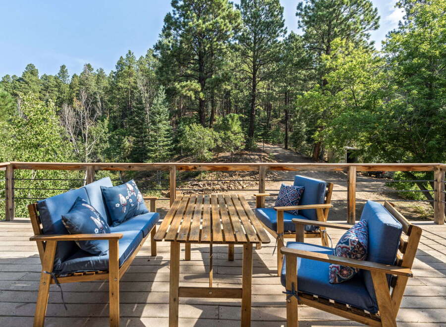 Enjoy the serene mountain views from this charming deck, perfect for outdoor relaxation.