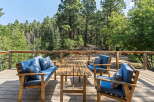 Enjoy the serene mountain views from this charming deck, perfect for outdoor relaxation.