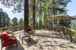 Enjoy breathtaking mountain views from this expansive wooden deck, perfect for outdoor entertaining or quiet relaxation.