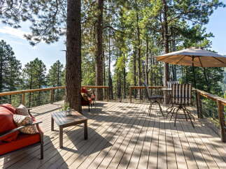 Enjoy breathtaking mountain views from this expansive wooden deck, perfect for outdoor entertaining or quiet relaxation.