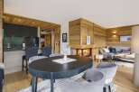 Experience rustic charm and modern comfort in this stunning living and dining area.