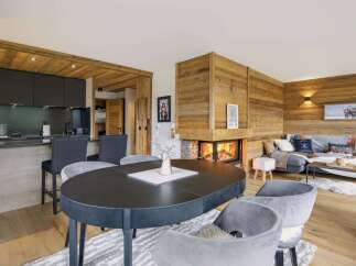 Experience rustic charm and modern comfort in this stunning living and dining area.