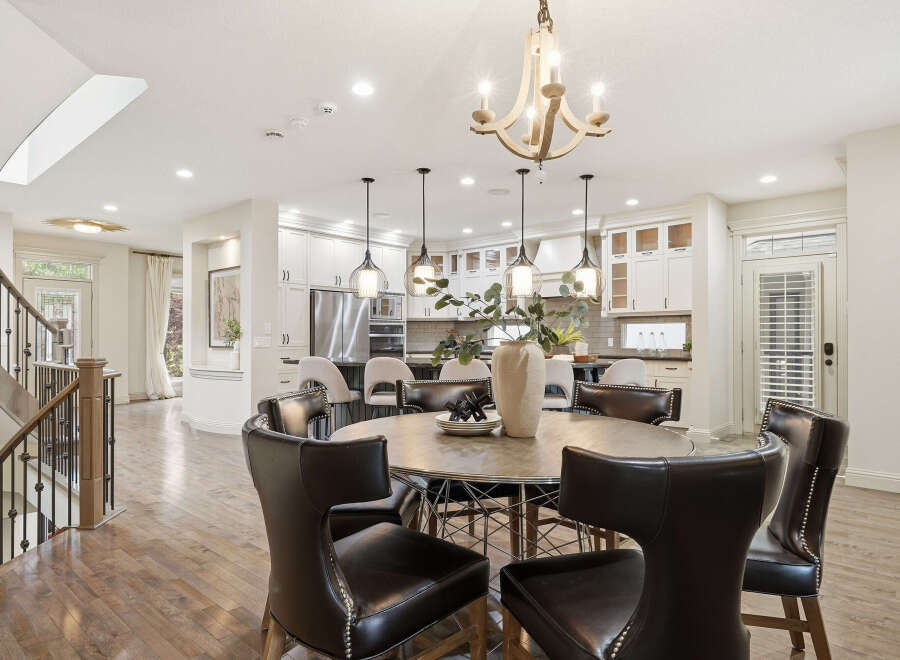 Experience elegant open-concept living with this stunning dining area and gourmet kitchen.