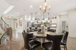 Experience elegant open-concept living with this stunning dining area and gourmet kitchen.