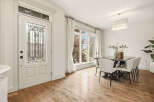 Step into a bright and airy dining space, perfect for hosting gatherings.