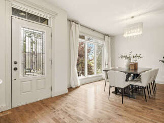 Step into a bright and airy dining space, perfect for hosting gatherings.