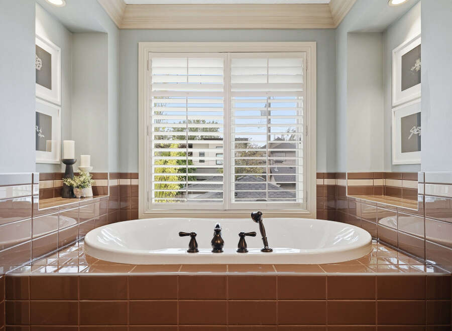 Indulge in relaxation in this luxurious bathroom, featuring a deep soaking tub perfect for unwinding.