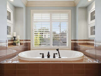 Indulge in relaxation in this luxurious bathroom, featuring a deep soaking tub perfect for unwinding.