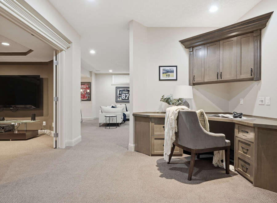 Discover this inviting basement living space, perfect for relaxation and productivity.
