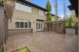 Step outside to a spacious, multi-level deck perfect for entertaining, featuring a charming pergola with built-in seating and storage.
