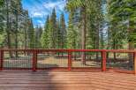 Enjoy the serene mountain views from this beautiful wooden deck, perfect for outdoor living.