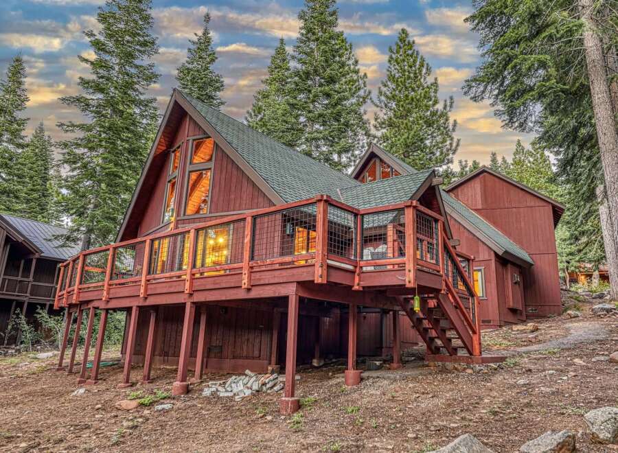 Experience mountain living in this charming A-frame cabin nestled among tall pine trees.