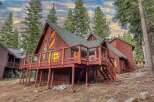 Experience mountain living in this charming A-frame cabin nestled among tall pine trees.