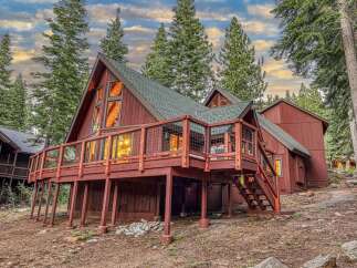 Experience mountain living in this charming A-frame cabin nestled among tall pine trees.