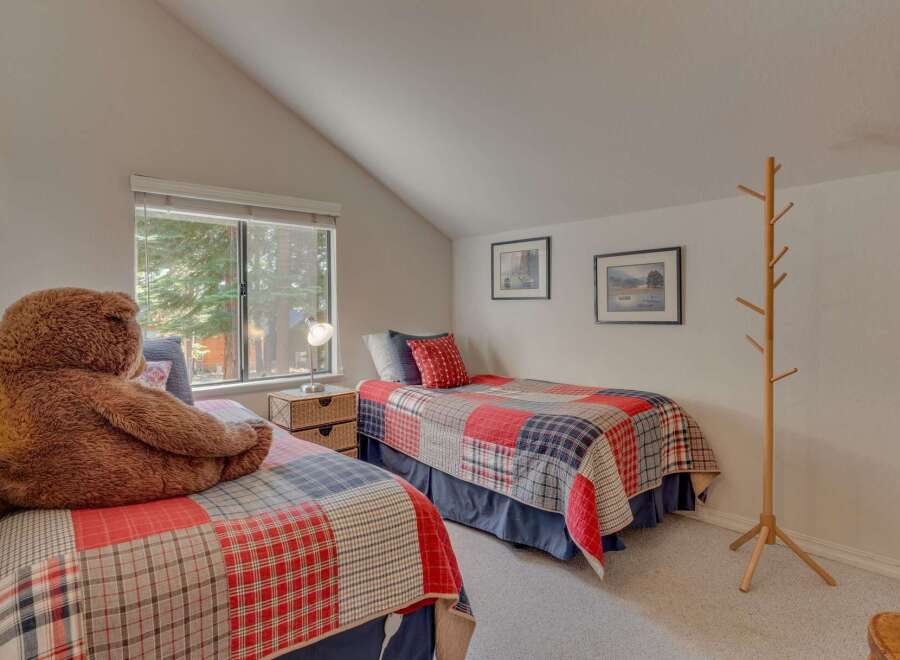 This charming bedroom features two cozy twin beds, perfect for guests or children.