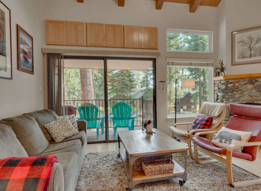 Cozy living room with a plush sofa and a rustic coffee table, perfect for relaxing after a day of outdoor adventures.