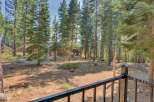Nestled amidst towering pine trees, this property offers a serene and private retreat.