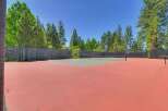 Enjoy outdoor recreation on this pristine tennis court, perfect for a friendly match or practice.