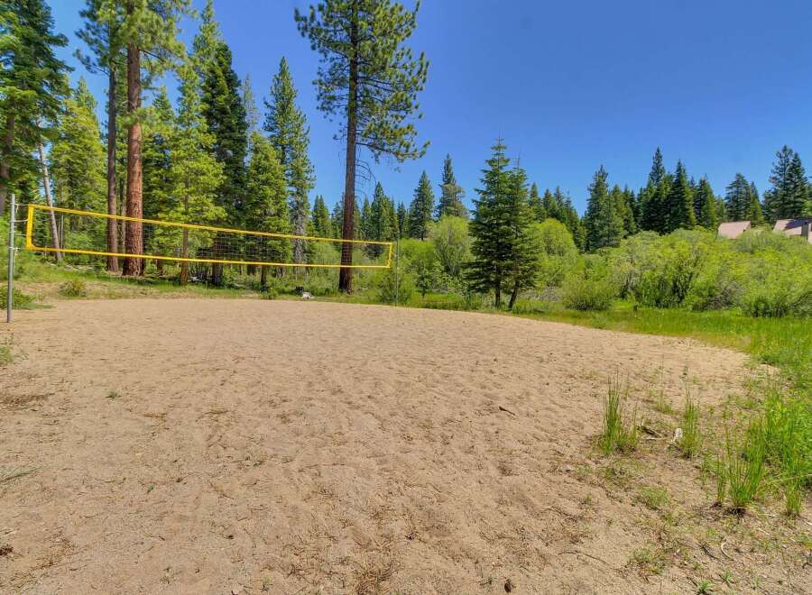 Enjoy outdoor recreation with this fantastic sand volleyball court, perfect for friendly games and summer fun.