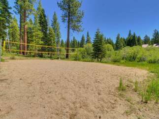 Enjoy outdoor recreation with this fantastic sand volleyball court, perfect for friendly games and summer fun.