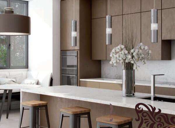 Experience modern living in this stunning kitchen featuring sleek, taupe cabinetry and a spacious island perfect for entertaining.