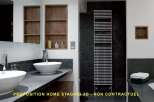 Experience modern luxury in this stunning bathroom featuring dual vessel sinks atop a sleek, dark countertop.