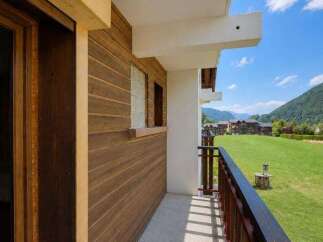 Enjoy breathtaking mountain views from this charming balcony, perfect for your morning coffee or evening relaxation.