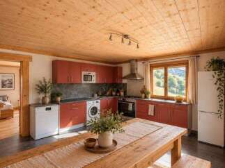 Experience rustic charm in this beautifully appointed kitchen, featuring warm wooden ceilings and cabinetry.