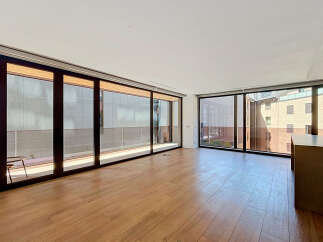 Experience modern living in this spacious apartment featuring floor-to-ceiling windows that flood the open-concept living area with natural light.