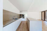 Experience modern living in this sleek, contemporary kitchen featuring a spacious island and ample counter space.
