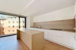 Experience modern living in this stunning kitchen featuring a sleek island and ample counter space.
