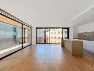 Experience modern living in this spacious, open-concept apartment featuring floor-to-ceiling windows that flood the space with natural light.