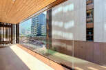 Experience modern living with this stunning balcony offering breathtaking city and mountain views.