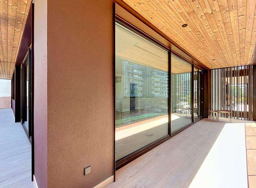 Experience modern living in this stunning property featuring expansive floor-to-ceiling windows that flood the space with natural light.