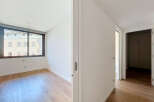Step into this bright and airy room featuring a large window that floods the space with natural light.