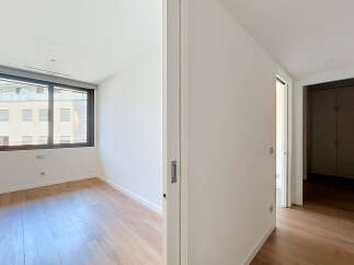 Step into this bright and airy room featuring a large window that floods the space with natural light.