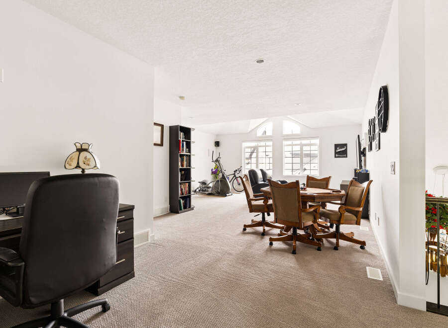 This spacious room offers a versatile layout, perfect for both work and leisure.