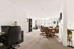 This spacious room offers a versatile layout, perfect for both work and leisure.