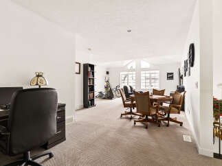 This spacious room offers a versatile layout, perfect for both work and leisure.