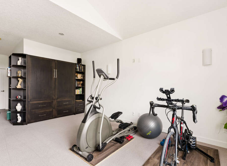 Transform your home into a personal fitness sanctuary with this dedicated workout space.