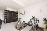 Transform your home into a personal fitness sanctuary with this dedicated workout space.