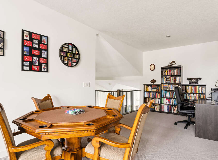 This versatile bonus room offers a perfect blend of entertainment and productivity.