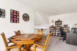 This versatile bonus room offers a perfect blend of entertainment and productivity.